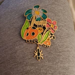 Pretty floral and insect brooch